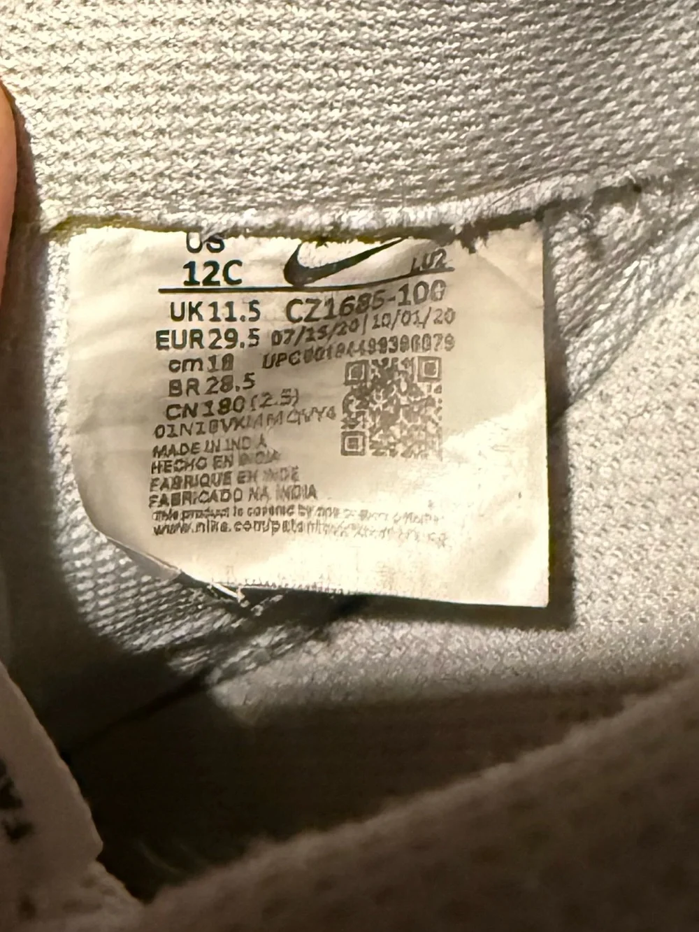Nike Kids White Sneakers with Black Swoosh